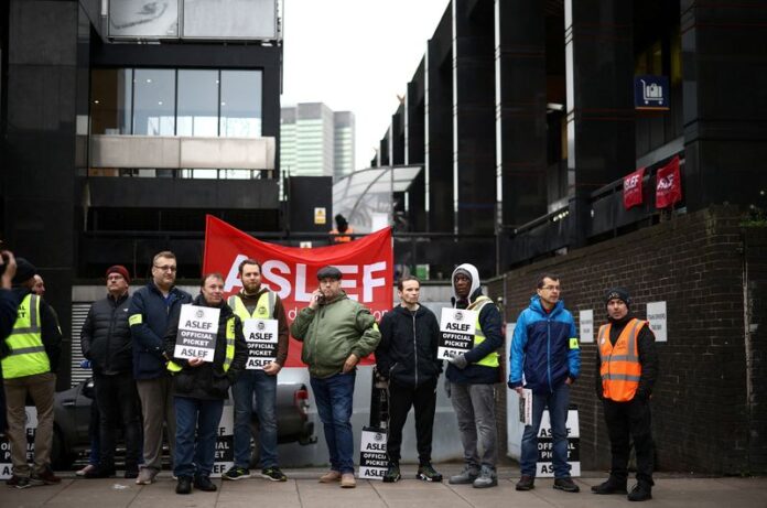FILE PHOTO: Rail workers that are members of the ASLEF union go on strike in London