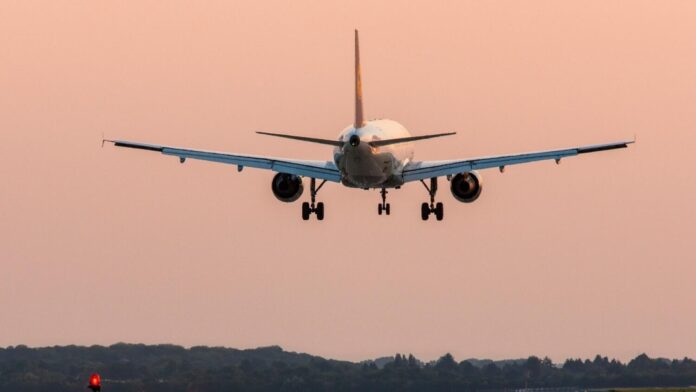 Passenger airplane approaching Dusseldorf International Airport. Germany.
